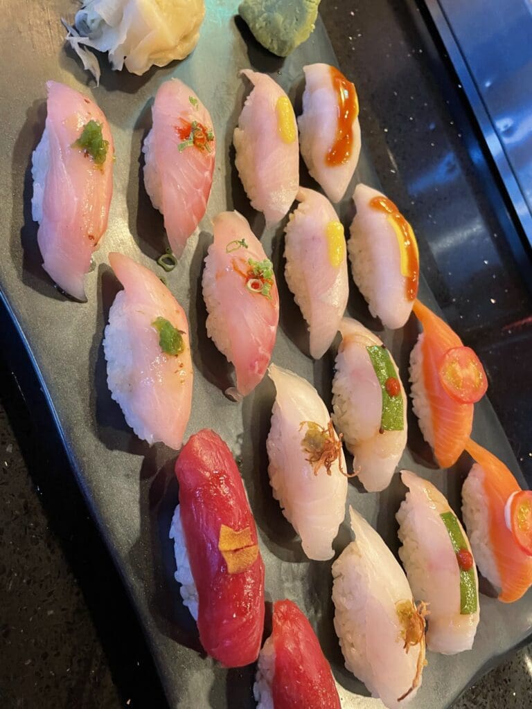 assorted sushi on rectangular plate