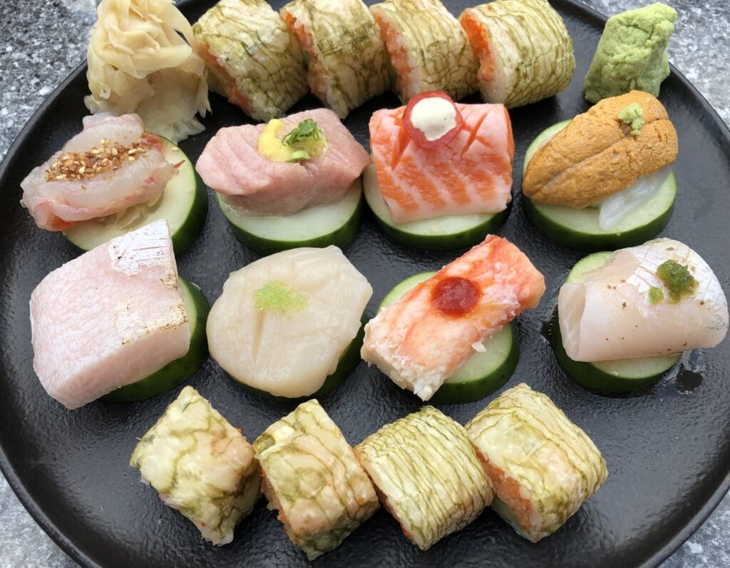 different types of sushi on a plate