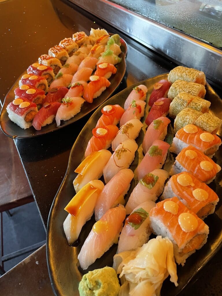 big plates of assorted sushi