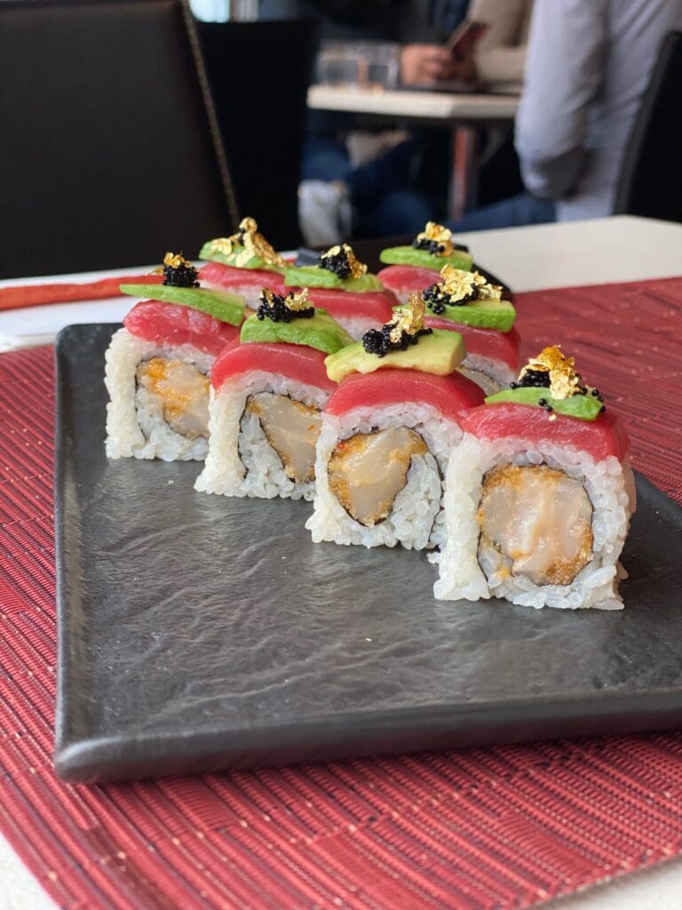 sushi rolls topped with tuna